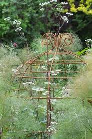 A very strong support which blends beautifully with roses and will also restrain buddleias, tree peonies, mallows and large established clumps of. 10 Best Gardening Cloche Images In 2020 Garden Cloche Plant Supports Garden Trellis