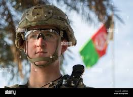 Pvt. Samuel Malanowski, Comanche Company, 1st Battalion, 501st Parachute  Infantry Regiment, 4th Brigade(Airborne), 25th Infantry Division scans for  possible security threats at the headquarters for the Afghan National  Police's 202nd Zone. Security
