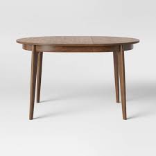 The expansion leaves are hidden in the body of the table. Astrid Mid Century Round Extendable Dining Table Brown Project 62 Target