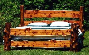 It features unusual both a headboard and a footboard that look like tangles of curling and braided boughs. Eastern Red Cedar Board Post King Size Bed Fred Beckhorn Rustic Log Furniture Cedar Furniture Rustic Wood Furniture
