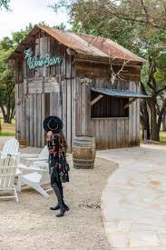 Landry Has Landed Girl In Black Dress And Black Hat Standing Outside Of The Wine Barn Outdoors At Signor Vineyards Fredericksburg Texas Fredericksburg Winery