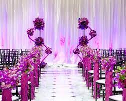 Purple Ceremony Decor With Heavily Decorated Aisle Markers And Unusual Purple Wedding Ceremony Decor Wedding Flower Arrangements Purple Purple Wedding Flowers