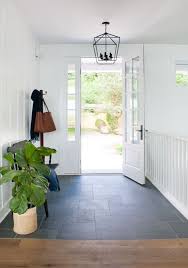 Swedish interior designer daniel heckscher from note design studio updated what was once a cookie cutter apartment foyer into a playful entryway using porcelain tile. Blue Slate Entry Way Tile Entryway Tile Home Floor Design