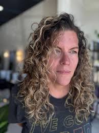 Toddler playing with hair, motherhood experiences