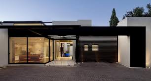 The house is entered via a courtyard on the left side, with the carport to the left and the pool directly behind the house. Single Storey Home With Flat Roof For Future Vertical Expansion