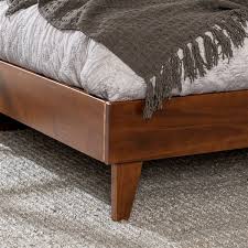 A center beam adds reinforcement and support legs add stability. Walker Edison Solid Wood Queen Platform Bed Walnut Lwwqplatwt Rona