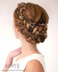 Low Braided Flower Adorned Bun Flower Crown Hairstyle Medium Hair Styles Wedding Hairstyles For Long Hair