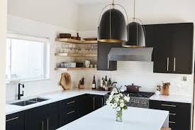 The massive kitchen island uses white soapstone with flat edging for its counter top, while the main kitchen counters uses black granite and clay stone mosaic tiles for the backsplash. 5 Must Have Items In Any High End Kitchen The Architects Diary
