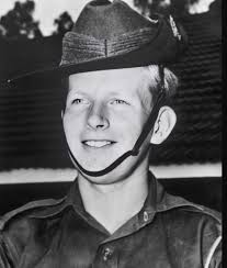 VWS South Vietnam. 10 November 1971. Lieutenant (Lt) Mick Murphy of  Townsville, Qld, calls `clear' as he checks the weapon of one of his  tracker platoon members who had just returned to