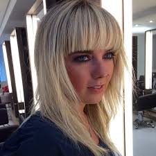 It can be hard to pull off a fringe hairstyle. Long Shaggy Hair With V Cut Layers And Full Blunt Bangs On Blonde Hair With Dark Roots The Latest Hairstyles For Men And Women 2020 Hairstyleology