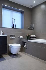 Tiling halfway up the walls with a deeper grey, and painting the rest with a lighter shade really adds height to a small bathroom. 25 Gray And White Small Bathroom Ideas Gray Bathroom Decor Small Bathroom Remodel Bathroom Interior