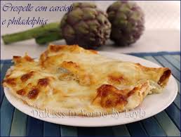 La sottilissima, morbida e delicata crêpe esalta e valorizza la qualità e il profumo dei carciofi. Crespelle Ai Carciofi Con Philadelphia E Besciamella Dulcisss In Forno