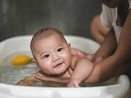 If your baby can only get in a good bath a few times a week, you are actually totally it's helpful to fill the baby tub or sink with a few inches of water before immersing your baby in it. Baby Bath Temperature What S The Ideal Plus More Bathing Tips