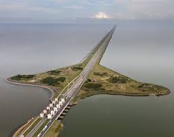 Afsluitdijk is the longest dyke in the netherlands, created bij a dutch civil engineer, cornelis lely, with the length of 32 kilometres (20 mi) and a width of 90 metres (300 ft), at an initial height of 7.25 metres (23.8 ft) above sea level. Afsluitdijk Dam North Holland Netherlands Travel Netherlands