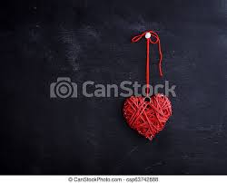 Maybe you would like to learn more about one of these? Small Wicker Red Heart Hangs On A Rope Against A Black Background Copy Space Canstock