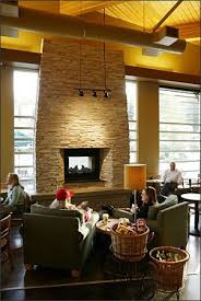 On Architecture Starbucks Puts A Double Shot Of Hometown Flavor Into Every Store Coffee Shop Decor Cozy Coffee Shop Indoor Outdoor Fireplaces