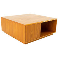 The metal net bottom adds a trendy design to it. Jesper International Midcentury Danish Teak Large Storage Coffee Table At 1stdibs
