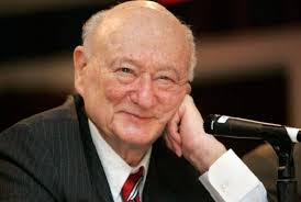 Ed Koch Throws Chin Music at Stanley Simon from the Grave