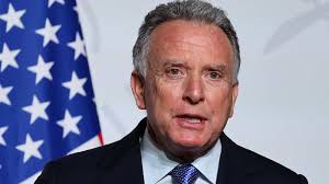 Large snake startles beachgoers as it emerges from the waves