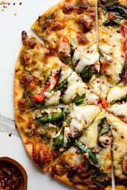 Loaded Pesto Veggie Pizza Recipe In 2021 Veggie Pizza Pizza Recipes Homemade Vegetarian Pizza