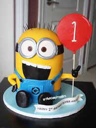 This free cake, decorated with icing, a border, and an inscription, is the baby's own cake to enjoy. Thecakinggirl Minion Birthday Cake Boy Birthday Cake Fondant Minions