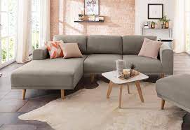 Sitzgarnitur aus blauem velourstoff mit holzfüßen, sessel, hocker, 8 kissen und holztisch. Home Affaire Ecksofa Lasse Im Scandinavischen Stil Mit Holzfussen Online Kaufen Otto