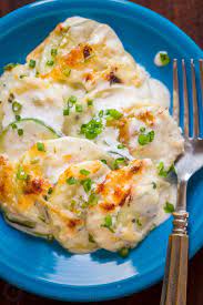 Creamy Cheesy Zucchini Potato Bake In A Garlic Alfredo Sauce This Potato Bake Recipe Has Simple Ingredients Zuchinni Recipes Recipes Baked Zuchinni Recipes