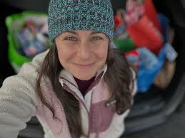 This family photo is called: What do we do with our hands? • Alternate  titles: My hat/hair is in my eyes. Straddle the dogs so they don't run  away. And Not another