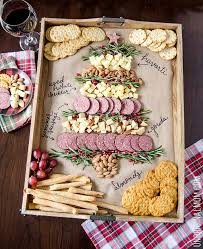 Christmas tree shaped appetizers mix together mayonnaise, dry ranch salad dressing mix and one cup of shredded cheddar cheese. Easy Christmas Tree Cheeseboard Holiday Entertaining Tips Unoriginal Mom