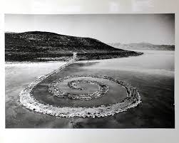 Robert smithson's iconic earthwork spiral jetty (1970) is a 1,500 foot long and 15 foot wide coil of local basalt rock and earth that extends into the red waters of the great salt lake in utah. Gianfranco Gorgoni Robert Smithson Spiral Jetty Printed Matter