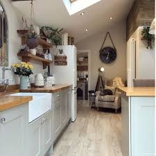 Avoid awkward scallops of light by aligning the downlights with cabinet doors, as seen in this kitchen designed by mosaic architects boulder. How To Plan Recessed Lighting In Your Kitchen