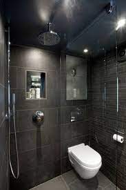 I remember when i was in high school, studying japanese, i learned this design feature and thought it was a bit weird. Dark Tiles Small Shower Room Wet Rooms Bathroom Design Small