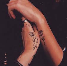 Instead of getting a bracelet tattoo made of flower or flower vine you can also try a bracelet tattoo made of leaves or even a branch like this. Rose Wrist Tattoos Tiny Tattoo Inc