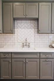 We look forward to hearing from you! White And Gray Kitchen Features Gray Shaker Cabinets Paired With White Quartz Count Subway Tile Backsplash Kitchen Kitchen Tiles Backsplash White Kitchen Tiles
