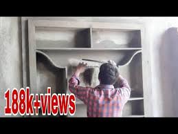 A wooden wall showcase design takes over an entire wall. Showcase Cupboard Work Showcase Cupboard Designs Showcase Cupboard Part 3 Youtube Wall Showcase Design Showcase Design Compound Wall Design
