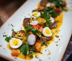 braised lamb tongues with pistachios mustard lemon sauce parsley quail egg braised lamb braised lemon sauce