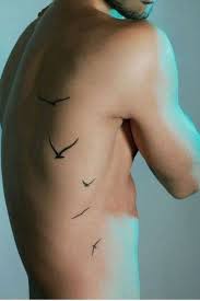 Cool tattoos on ribs for guys. Birds Tattoo On Rib For Men Rib Tattoos For Guys Cool Tattoos For Guys Small Tattoos For Guys