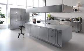 These cabinets have a unique design with numerous cabinets for storing various items. A Stainless Steel Kitchen Designed For At Home Chefs