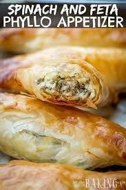 The traditional cheese and spinach pie, spanakopita, has a lot going for it, including buttery, cheesy goodness and a crisp phyllo crust. Spanakopita Triangles Are Greek Pastry Hand Pies Filled With Spinach And Feta Cheese The Layers Of Phyllo Do Phyllo Appetizers Phyllo Recipes Spinach And Feta