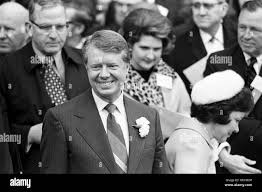 State Senator Jimmy Carter waits to be sworn in as Georgia's new governor .  Carter is seated with wife Rosalynn Carter and daughter Amy Carter at the  Georgia Governors Inauguration. Atlanta. 1971