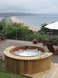 Our Wooden Hot Tubs Are Constructed In The Traditional Barrel Style Cedar Wood Cedar Is Renowned For Its Longev Hot Tub Landscaping Pool Hot Tub Hot Tub Cover