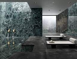 Marble tile lines the shower for a luxurious feel. Ultra Marmi Ariostea