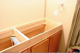 You can customize bathroom vanities to the most convenient height for you and your bathroom. Remodelaholic How To Raise Up A Short Vanity