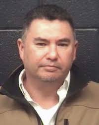 Woman arrested after hitting police vehicle