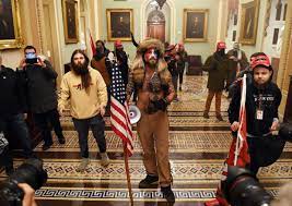 Capitol riot exposes reach of qanon disinformation. Jake Angeli Qanon Man In Fur Hat Horns During Capitol Riot Arrested