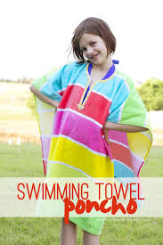 My kids started swim lessons last week, so i hurried and whipped up i actually got the idea from some character hooded towel ponchos i saw in bed, bath, & beyond and just hold the pattern in place and do your best. Diy Swimming Towel Poncho