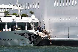 A cruise ship crashed into a venice dock on sunday, hitting a moored tourist boat and sending onlookers running for safety in what one witness said resembled a scene from a disaster movie.. Cruise Ship Slams Into Dock In Venice Time