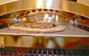 After about 90 seconds, the crust on the perimeter was browning, and the cheese was melting. Review Camp Chef Pizza Oven Accessory Smoking Meat Forums The Best Barbecue Discussion Forum On Earth