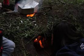 Digging a hole for a fire pit. Dakota Fire Pits Campfire Kitchen