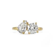 Click here to see photos of the model's new accessory. This Two Stone Engagement Ring Is Practically A Dupe Of Emily Ratajkowski S Stone Engagement Rings Engagement Rings Gold Anniversary Rings